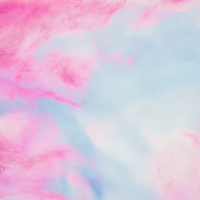 Cotton candy pink clouds against a blue sky